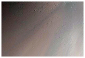 Crater Excavation of Uncommon Hydrous Minerals