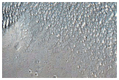Intersecting Linear Troughs Near Wall of Ius Chasma
