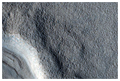 Dipping Layers in Crater in Deuteronilus Mensae

