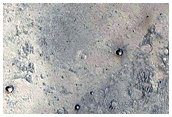 Interaction of Layered Intracrater Deposit with Crater Wall