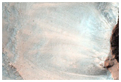 Pit on Crater Floor Exposing Layered Bedrock