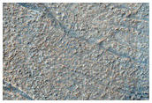 Crater and Band in Hellas Planitia
