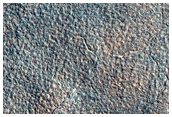 Crater and Ejecta on Northern Plains
