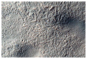 Layered Features in Craters in Hellas Montes Region
