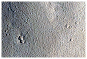 Pitted Material on Floor of Well-Preserved Crater in Elysium Planitia
