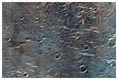 Crater Exposing Layered Ejecta in Tyrrhena Terra
