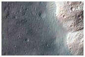 Well-Preserved Impact Crater with Gullies

