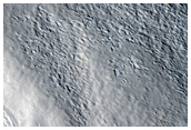 Crater and Channels in Acheron Fossae Region
