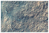 Crater Floor Pit with Hints of Layering
