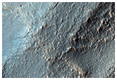 Possible Layer Tilts in Well-Exposed Layered Crater Floor Materials
