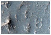 Topographic Transition from Chaotic Terrain to Outflow Channel Terrain

