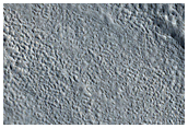Layered Feature in Crater near Hrad Vallis
