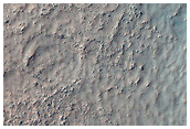 Trough Intersecting Crater and Ejecta

