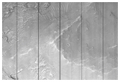 Layers in Crater Depression Near Sklodowska Crater
