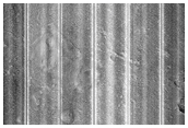 Layered Feature in Crater in Galaxias Fossae
