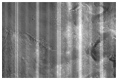 Dipping Layers in Ismenius Fossae
