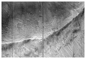 Crater with Layered Ejecta and Possible Faulting
