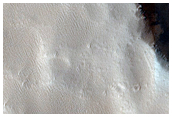 Impact Craters in Flow North of Ascraeus Mons
