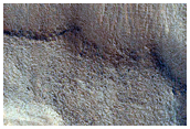 Dipping Layers Against Mound in Northern Mid-Latitudes
