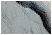 Fractures and Pits on Flank of Pavonis Mons

