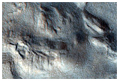 Surface Pits and Cracks in Phlegra Montes
