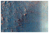 Layers in Mantle along Wall of Southern Mid-Latitude Crater 
