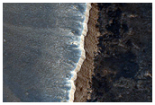 Impact Crater and Lava Channel South of Noctis Labyrinthus
