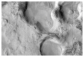 Layered Crater Deposits in Nilosyrtis Region
