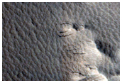 Impact Crater with Layered Ejecta Near Biblis Patera
