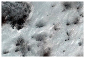Cryptic Terrain Margin Monitoring Near Promethei Rupes
