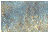 Well-Preserved Crater and Wrinkle Ridge
