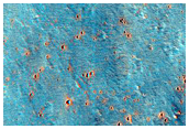 Crater-Related Pitted Materials Adjacent to 6-Kilometer Diameter Crater
