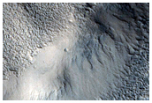Interaction between Channel and Complex Pitted Terrain
