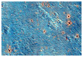 Crater-Related Pitted Materials Adjacent to 6-Kilometer Diameter Crater

