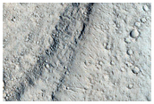 Streamlined Shapes Near Tartarus Colles
