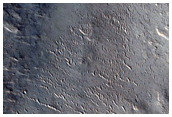 Valley Cutting Crater Rim North of Amenthes Rupes
