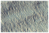 Pit in Mid-Latitude Mantle
