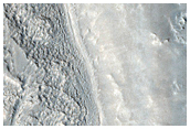 Narrow Fractures Near Crater Ejecta
