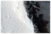 Crater with Fluidized Ejecta West of Arsia Mons
