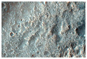 Sinuous Channels with Rocky Floor
