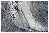 Layered Feature Leaning Against Crater Wall in Protonilus Mensae
