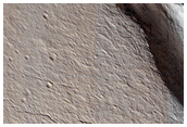 Cracks in Crater Deposit in Acheron Fossae
