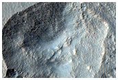 Pit in Mid-Latitude Mantle
