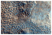 Small Pits in Crater Ejecta in Northern Arabia Terra
