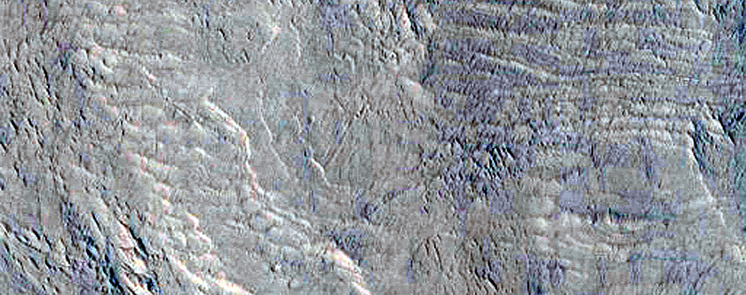 Stratified Materials in Memnonia Sulci