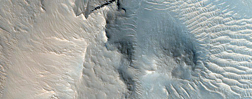 Layered Material in Intermountain Valleys West of Argyre Planitia
