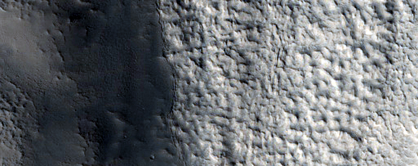 Fluvial Outflows Off of Layered Plains
