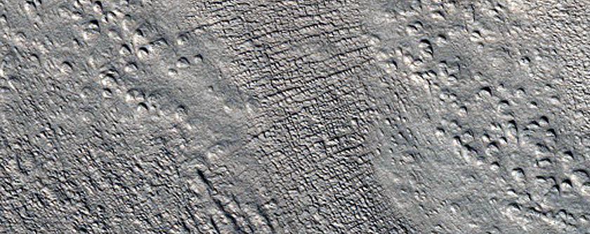 Flow of Material Through Gap in Crater Rim in Phlegra Montes
