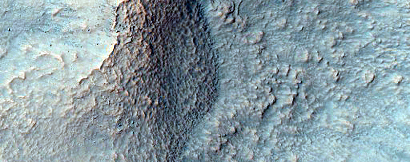 Well-Preserved 7-Kilometer Crater with Bedrock Exposure
