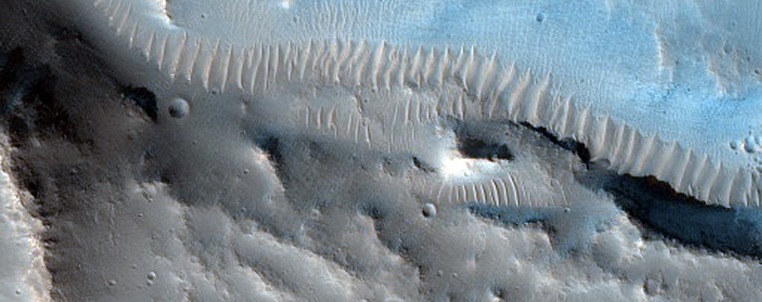 Channel on Edge of Crater West of Idaeus Fossae

